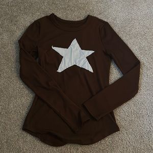 Brown long sleeve with white star in the middle